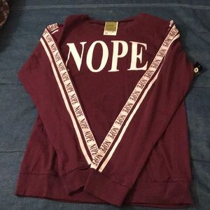 Never worn. Tag still attached. Long sleeve shirt.